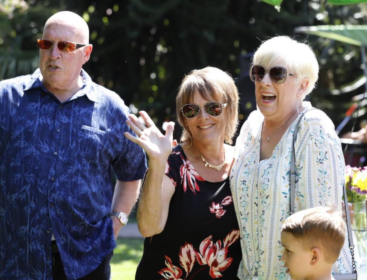 Vancouver resident Renee Amies, center, visits with friends Steve Vest, left, and Tricia Vest, right, of Brush Prairie, at Amies’ retirement party for her 43-year career with Weight Watchers, or WW. Amies began working for the company in a part time capacity, while looking to lose about 40 pounds.