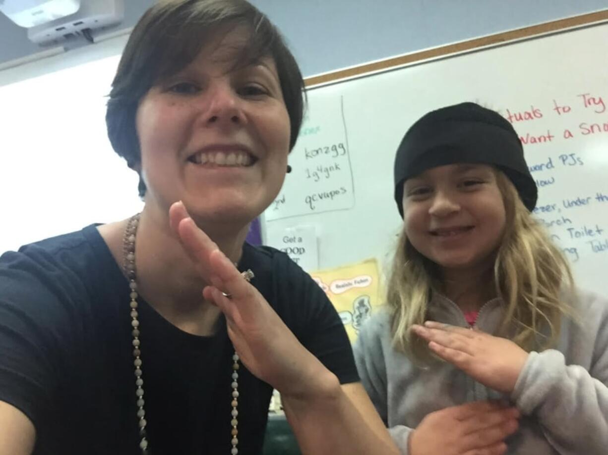 Ridgefield: Union Ridge Elementary School Librarian Jubilee Roth strikes a pose with Master Ninja Librarian Ruby Stenbak.