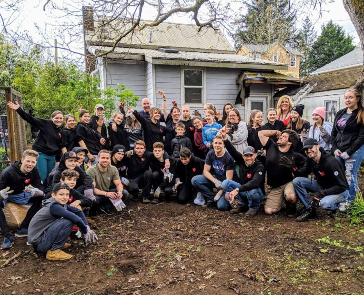 Camas: The group of 54 volunteers from Acts Church who helped clean up an elderly neighbor’s yard.