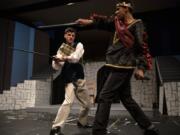 MacDuff (Justin Linsday), left, can no longer endure the savagery of Macbeth (Jaleel Amusa) during his climb to the throne.