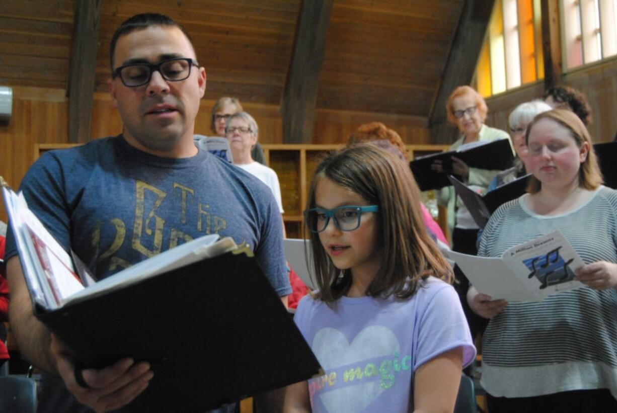 Courtesy Vancouver Master Chorale First tenors section leader Ryan Allen rehearses “A Million Dreams” with his daughter, Zoe, 8, who will sing with the Vancouver Master Chorale this weekend.