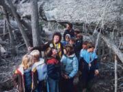 This photo that appeared in National Geographic World shows Allene Wodaege and Ron Ward with a group of 10 fifth-graders from Ridgefield during a 1983 into Mount St. Helens blast zone.