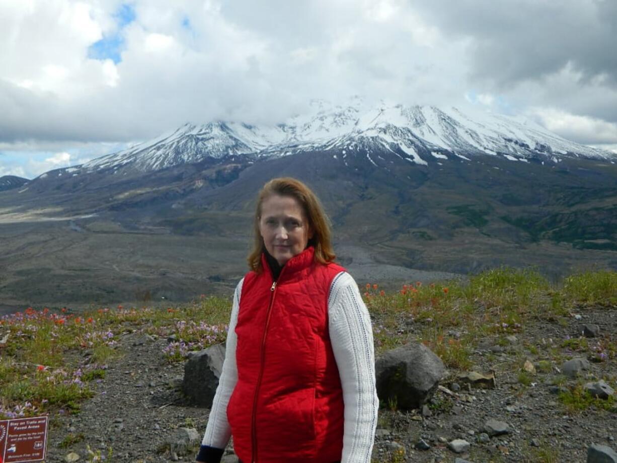 Author Melanie Holmes, with Mount St. Helens in the background. Holmes will give two talks on Saturday.