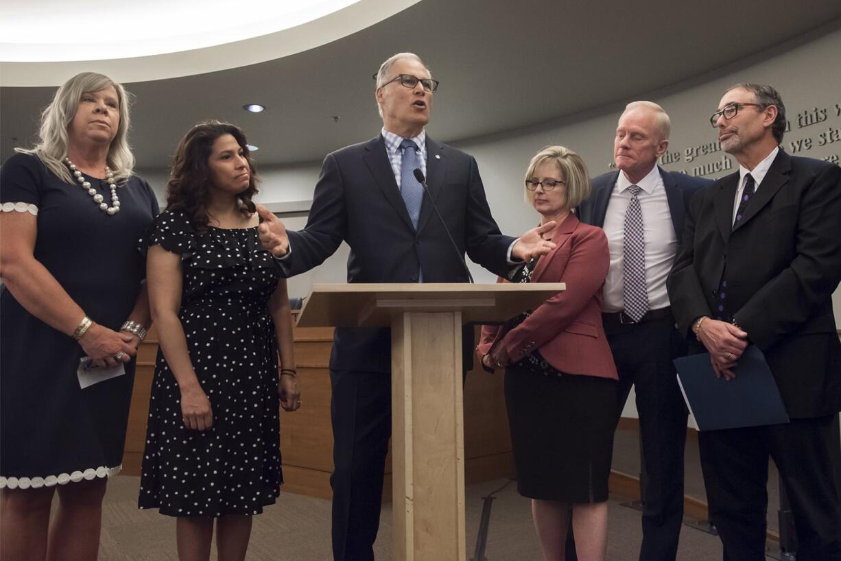 Holly Long, Evergreen School District's health services manager, from left, Rep. Monica Stonier, D-Vancouver, Governor Jay Inslee, Sen. Annette Cleveland, D-Vancouver,  Rep. Paul Harris, R-Vancouver,  and Dr. Alan Melnick speak before the signing of HB 1638 at Vancouver City Hall on Friday morning, May 10, 2019.