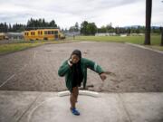 Evergreen junior Jasmine Tiatia sets up to throw during practice at McKenzie Stadium. The 3A district champion in the shot put has the top mark in 3A going into the WIAA state track and field championships this weekend.