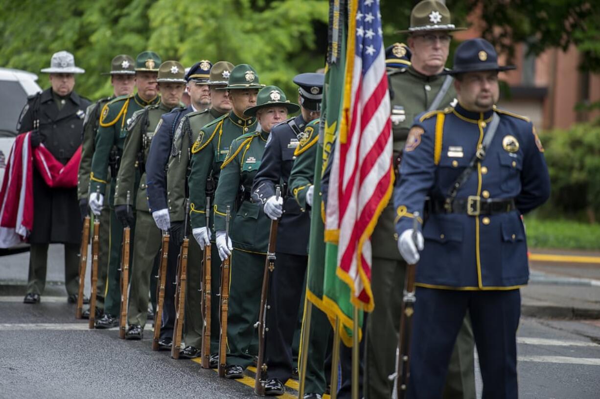 A multi-agency color guard lines up outside of the Clark County Public Service Center before the posting of the colors Thursday morning during the annual Law Enforcement Memorial Ceremony.