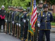 A multi-agency color guard lines up outside of the Clark County Public Service Center before the posting of the colors Thursday morning during the annual Law Enforcement Memorial Ceremony.