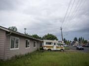 Cars drive past 10605 SE Mill Plain Blvd, which the city has voted to condemned to accommodate a safety corridor, on Wednesday morning, May 15, 2019.