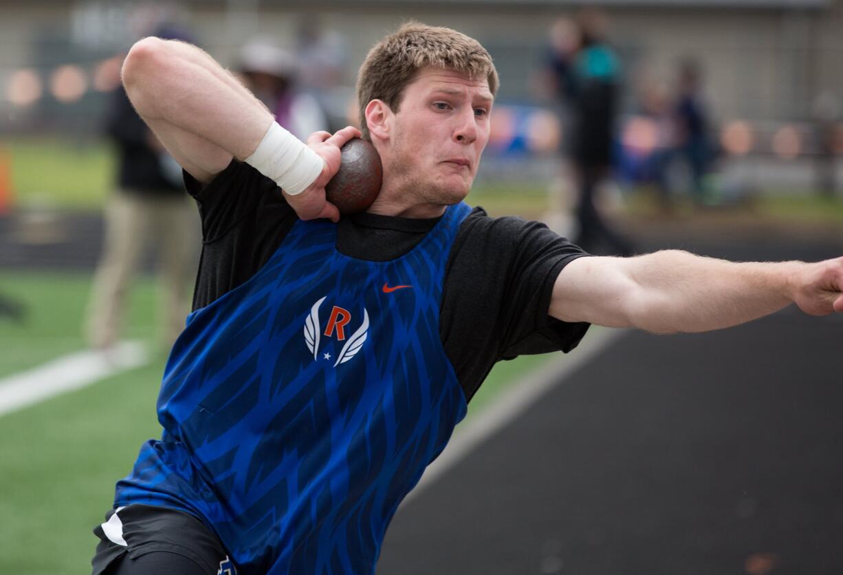 Ridgefield's Trey Knight competes in the boys shot put during the 2A District Track and Field Championships at Washougal High School, Friday, May 17, 2019.