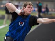 Ridgefield's Trey Knight competes in the boys shot put during the 2A District Track and Field Championships at Washougal High School, Friday, May 17, 2019.