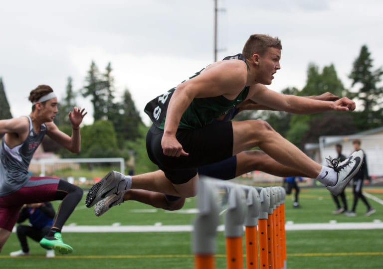 Woodland's Tyler Flanagan competes in the boys 110-meter hurdles during the 2A District Track and Field Championships at Washougal High School, Friday, May 17, 2019.