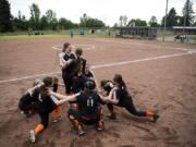 The East County Warriors circle up for a cheer before their game at George Schmid Memorial Park in Washougal on Tuesday. While the complex sees plenty of action, there is no electricity, running water or lights, but the city received more than $1 million in the state budget to make upgrades at the field. Now, Washougal and East County Little League officials are figuring out how to raise the rest of the funds to build a third field, add lights and get amenities to the complex.