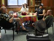 Director Paul Iarrobino, from left, storytellers Quinn McCray, Abasi Umoh, Joe Marshall, and Triple Point facilitator Stephen Herndon, bottom right, prepare for Sunday’s Prideful Voices Vancouver storytelling event. McCray, Umoh, Marshall, and a fourth speaker, Dhiren Grove, are presenting their coming-out journeys at the Unitarian Universalist Church of Vancouver.