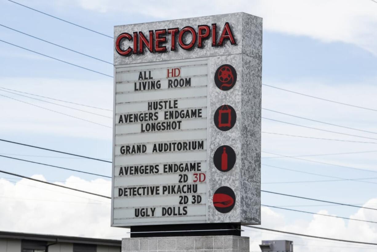 The marquee and box office displays at the Mill Plain Cinetopia still list showtimes for current movies, but the location is clearly closed.