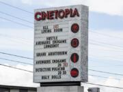 The marquee and box office displays at the Mill Plain Cinetopia still list showtimes for current movies, but the location is clearly closed.