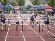 Mountain View’s Kate Kadrmas, center right, leads the pack to win the 3A Girls 100m Hurdles during the WIAA state track meet at Mount Tahoma High School in Tacoma on Friday, May 24, 2019.