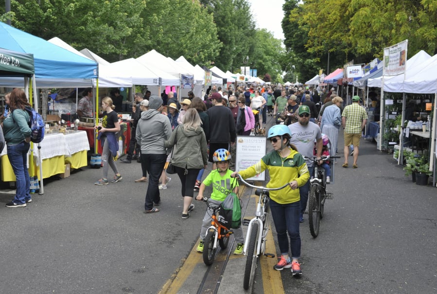 Customers crowd the Vancouver Farmers Market in 2019.