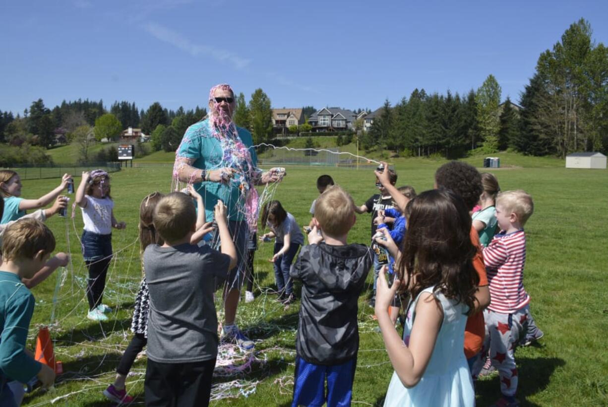 Washougal: For raising the most money during Gause Elementary School’s five-week Kid’s Heart Challenge, Lisa Haskins’ second-grade class earned the honor of spraying physical education teacher Mark Bauer with silly string.