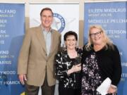 Battle Ground: From left: Don Kissell, Student Transportation of America’s senior vice president of the western region, Helen Peterson, Safety Wall of Fame inductee, and Marjorie Hatt, human resources director of the western region of the transportation agency, induct Peterson to the Wall of Fame.