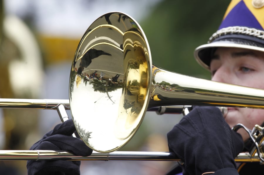 Underlying the shiny, brassy sound of the many marching bands in the Hazel Dell Parade is the organizational labor and data mangament of of Jody and Matt Gohlke at Music World.