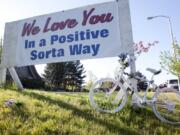 A memorial sign and white “ghost bike” photographed in 2009 alongside St. Johns Road, where cyclist and popular Hudson’s Bay High School teacher Gordon Patterson was killed by a driver who was texting while driving. A commemorative “Ride of Silence,” honoring all cycling casualties, is set for Wednesday.