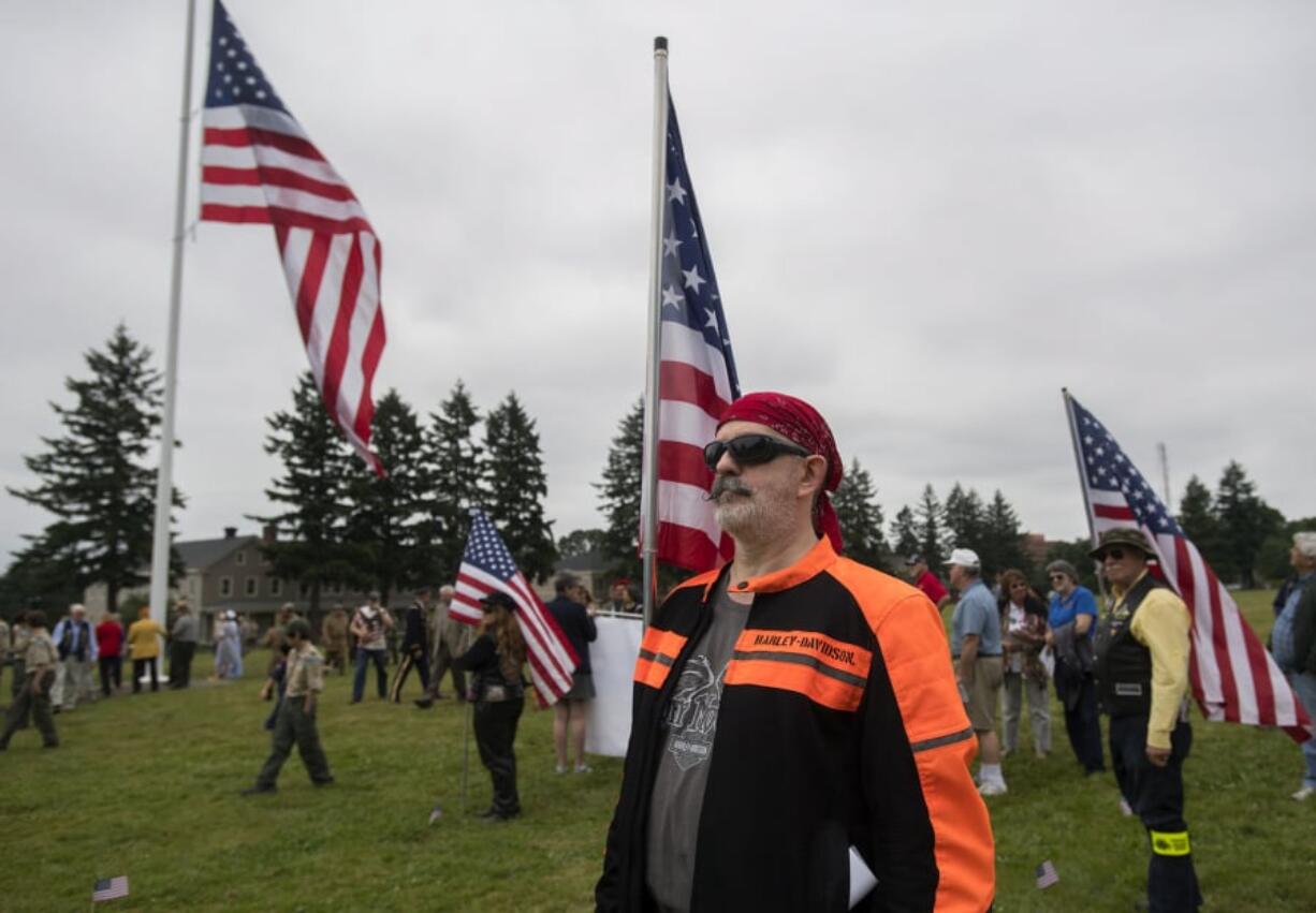 Camas resident Jerry Barbour, a member of the Patriot Guard Riders, stands at attention during the 2017 Memorial Day ceremony at the Fort Vancouver National Historic Site.