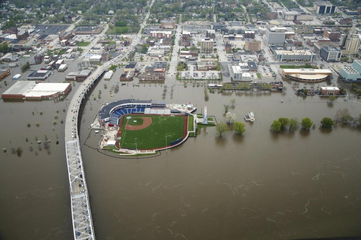 Downtown Davenport, Iowa,  is seen from the air as flood waters continue flow on Wednesday, May 1, 2019.  A flood wall broke on Tuesday sending water to near record levels with little to no warning.