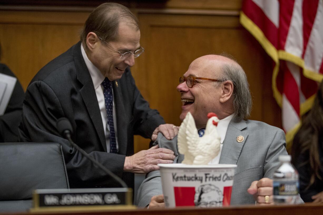 Judiciary Committee Chairman Jerrold Nadler, D-N.Y., left, laughs with Rep. Steve Cohen, D-Tenn., right, after Cohen arrived with a bucked of fried chicken and a prop chicken as Attorney General William Barr will not appear before a House Judiciary Committee hearing on Capitol Hill in Washington, Thursday, May 2, 2019. The House Judiciary Committee witness chair will be without its witness this morning, Attorney General William Barr, who informed the Democrat-controlled panel he will skip a scheduled hearing on special counsel Robert Mueller's report, escalating an already acrimonious battle between Democrats and the Justice Department.