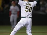 Oakland Athletics' Mike Fiers celebrates after pitching a no hitter against the Cincinnati Reds at the end of a baseball game Tuesday, May 7, 2019, in Oakland, Calif.