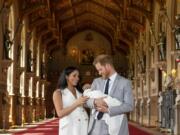 Britain's Prince Harry and Meghan, Duchess of Sussex, during a photocall with their newborn son, in St George's Hall at Windsor Castle, Windsor, south England, Wednesday May 8, 2019. Baby Sussex was born Monday at 5:26 a.m. (0426 GMT; 12:26 a.m. EDT) at an as-yet-undisclosed location. An overjoyed Harry said he and Meghan are "thinking" about names.