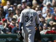 Seattle Mariners' Felix Hernandez walks off the field after being relieved during the third inning of a baseball game against the Boston Red Sox in Boston, Saturday, May 11, 2019.