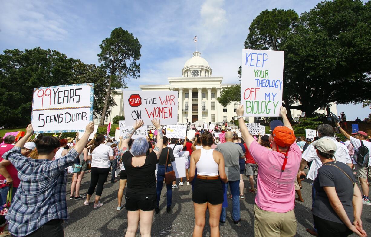 Protesters for women's rights hold a rally on the Alabama Capitol steps to protest a law passed last week making abortion a felony in nearly all cases with no exceptions for cases of rape or incest, Sunday, May 19, 2019, in Montgomery, Ala.