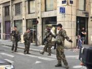 Soldiers of French anti terrorist plan "Vigipirate Mission", secure the area near the site of a suspected bomb attack in central Lyon, Friday May, 24, 2019.