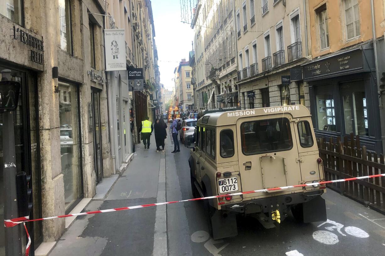 A vehicle of French anti terrorist plan "Vigipirate Mission", is seen near the site of a suspected bomb attack in central Lyon, Friday May, 24, 2019. A small explosion Friday on a busy street in the French city of Lyon lightly injured several people, local officials said.