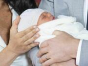 Britain’s Prince Harry and Meghan, Duchess of Sussex, during a photocall with their newborn son, in St George’s Hall at Windsor Castle, Windsor, south England, Wednesday May 8, 2019. Baby Sussex was born Monday at 5:26 a.m. (0426 GMT; 12:26 a.m. EDT) at an as-yet-undisclosed location. An overjoyed Harry said he and Meghan are “thinking” about names.