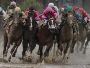 Flavien Prat on Country House, left, races against Luis Saez on Maximum Security, third from left, during the 145th running of the Kentucky Derby horse race at Churchill Downs Saturday, May 4, 2019, in Louisville, Ky. Maximum Security was disqualified and Country House won the race.