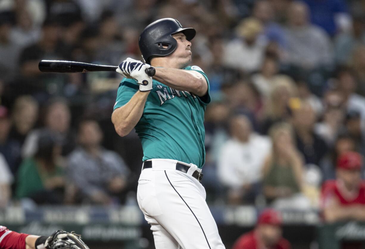 Seattle Mariners' Jay Bruce hits a solo home run off of Los Angeles Angels starting pitcher Tyler Skaggs during the seventh inning of a baseball game Friday, May 31, 2019, in Seattle. The home run was the 300th of Bruce'S career.