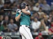 Seattle Mariners' Jay Bruce hits a solo home run off of Los Angeles Angels starting pitcher Tyler Skaggs during the seventh inning of a baseball game Friday, May 31, 2019, in Seattle. The home run was the 300th of Bruce'S career.