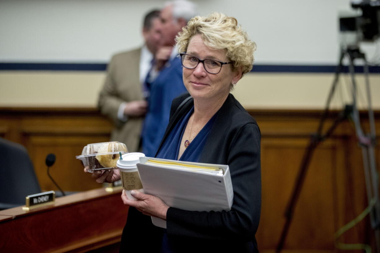 FIEL - In this April 2, 2019, file photo, Rep. Chrissy Houlahan, D-Pa., arrives for a House Armed Services Committee budget hearing for the Departments of the Army and Air Force on Capitol Hill in Washington. Congresswomen with military service in their past, some of them forged on post-Sept. 11 wars, are hoping to create their own caucus to drive an agenda to support the nation’s growing ranks of female service members.