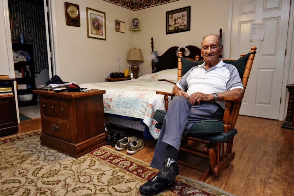 In this May, 21, 2019, photo, Dennis Trudeau, a World War II veteran who landed in Normandy on D-Day, poses for a photo at his home in Grovetown, Ga. Trudeau had joined the Canadian military at 17 and became a paratrooper in part because they paid an extra $50 a month.