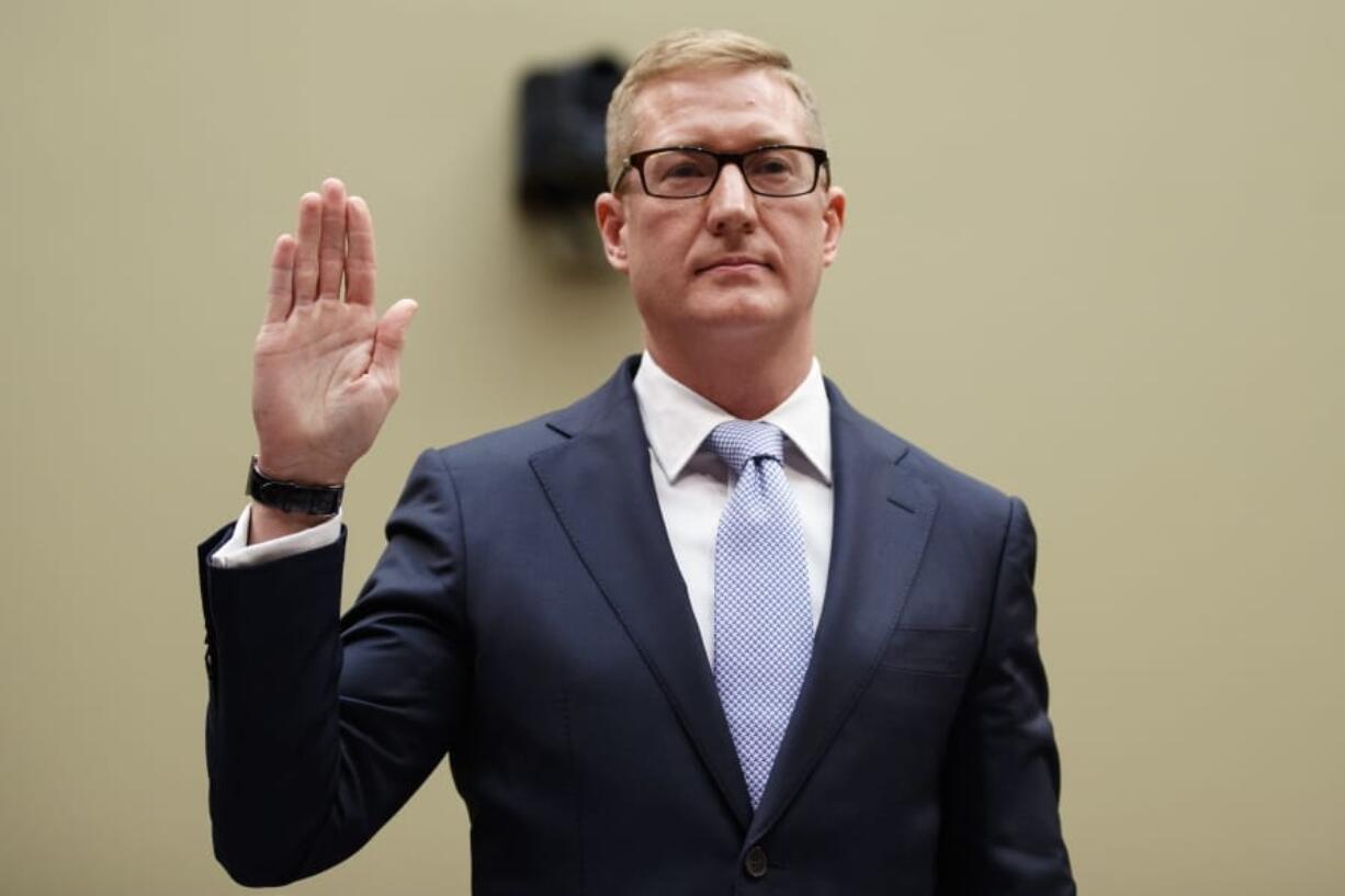 Deputy Assistant Attorney General for National Security Adam Hickey, is sworn in to testify on Capitol Hill in Washington, Wednesday, May 22, 2019, before the House Oversight and Reform National Security subcommittee hearing on “Securing U.S.