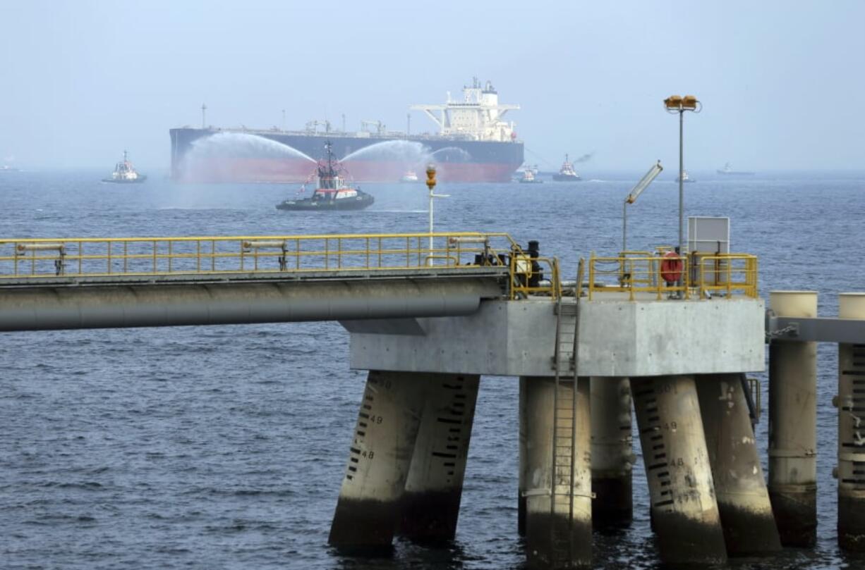 FILE - In this Sept. 21, 2016 file photo, an oil tanker approaches to the new Jetty during the launch of the new $650 million oil facility in Fujairah, United Arab Emirates. The United Arab Emirates said Sunday, May 12, 2019 that four commercial ships near Fujairah “were subjected to sabotage operations” after false reports circulated in Lebanese and Iranian media outlets saying there had been explosions at the Fujairah port.