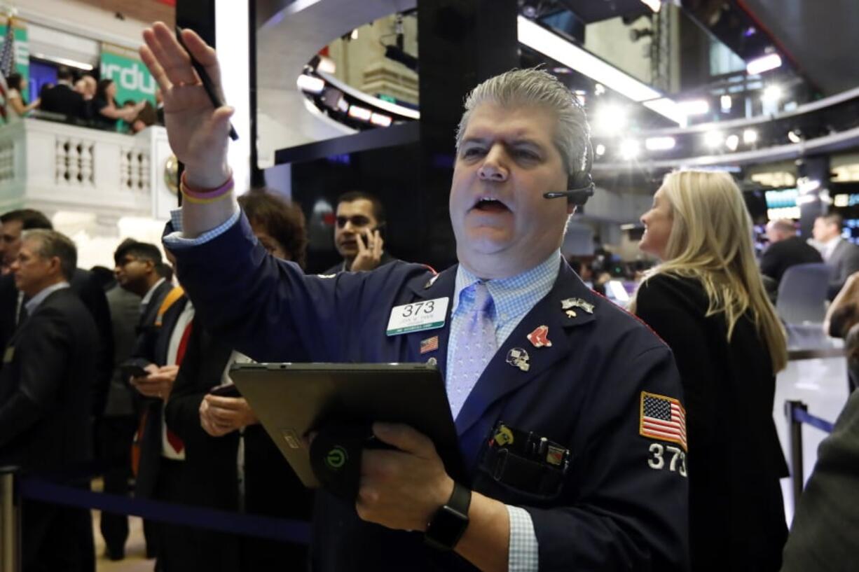 FILE - In this April 11, 2019, file photo trader John Panin works on the floor of the New York Stock Exchange. The U.S. stock market opens at 9:30 a.m. EDT on Tuesday, May 7.