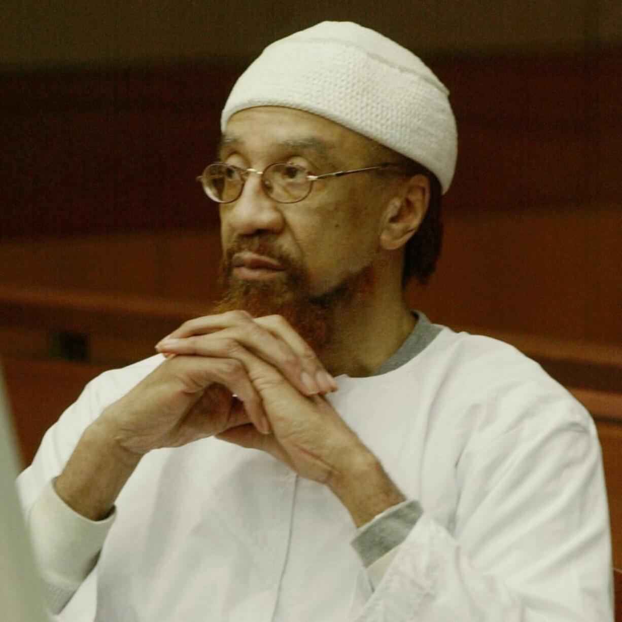 FILE- In this March 11, 2002 file photo, Jamil Abdullah Al-Amin watches during the sentencing portion of his trial in Atlanta. Al-Amin, the militant civil rights leader known in the 1960s as H. Rap Brown who was convicted of killing Fulton County Sheriff’s Deputy Ricky Kinchen and wounding Deputy Aldranon English in a shootout in March 2000, is challenging his imprisonment, saying his constitutional rights were violated at trial.