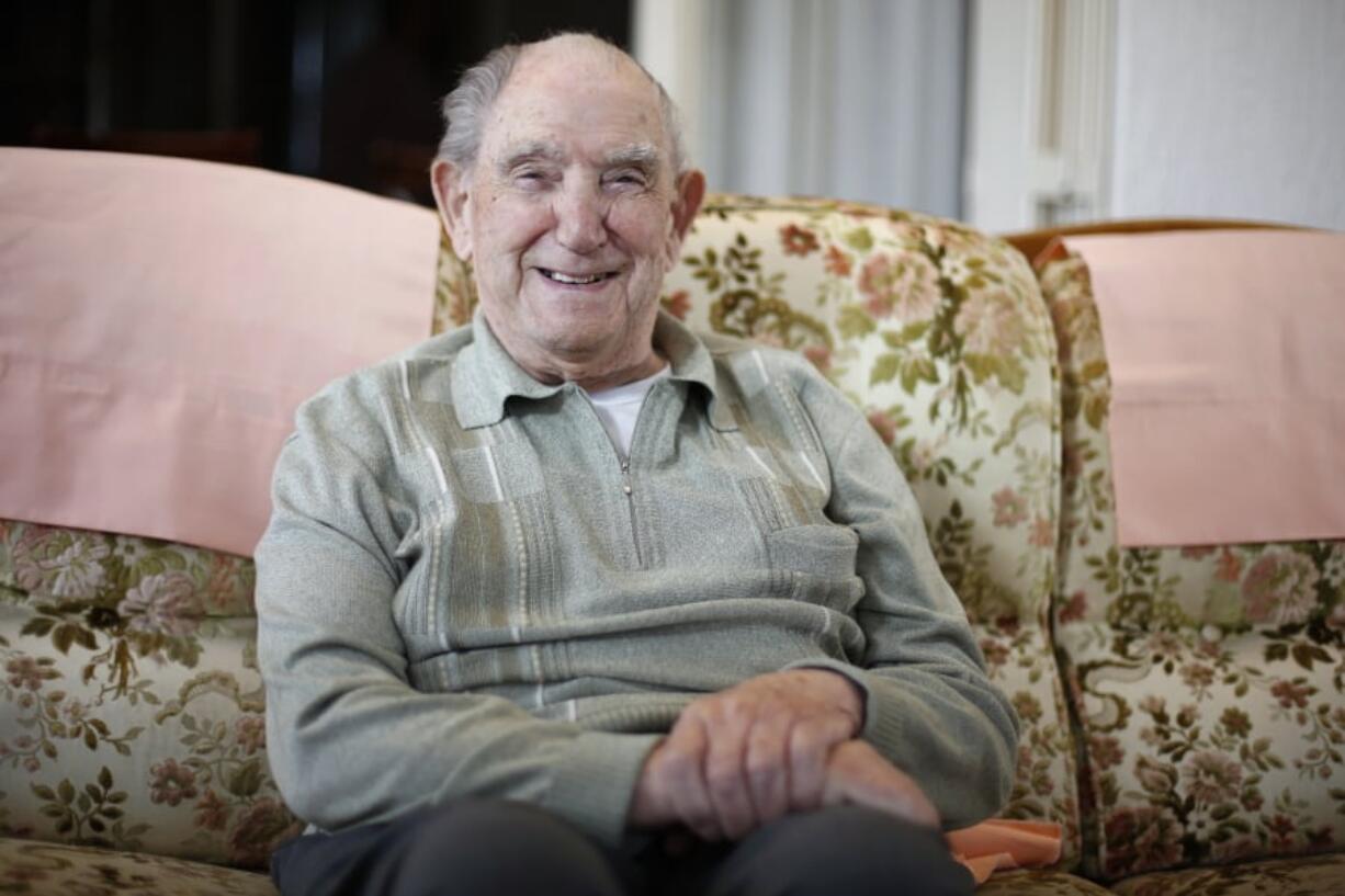 In this photo made May 9, 2019, French World War II veteran Leon Gautier, of the Kieffer commando, poses for a picture in his house, in Ouistreaham, Normandy. Gautier is a D-Day veteran who was part of a 177-man French force that landed on D-Day.