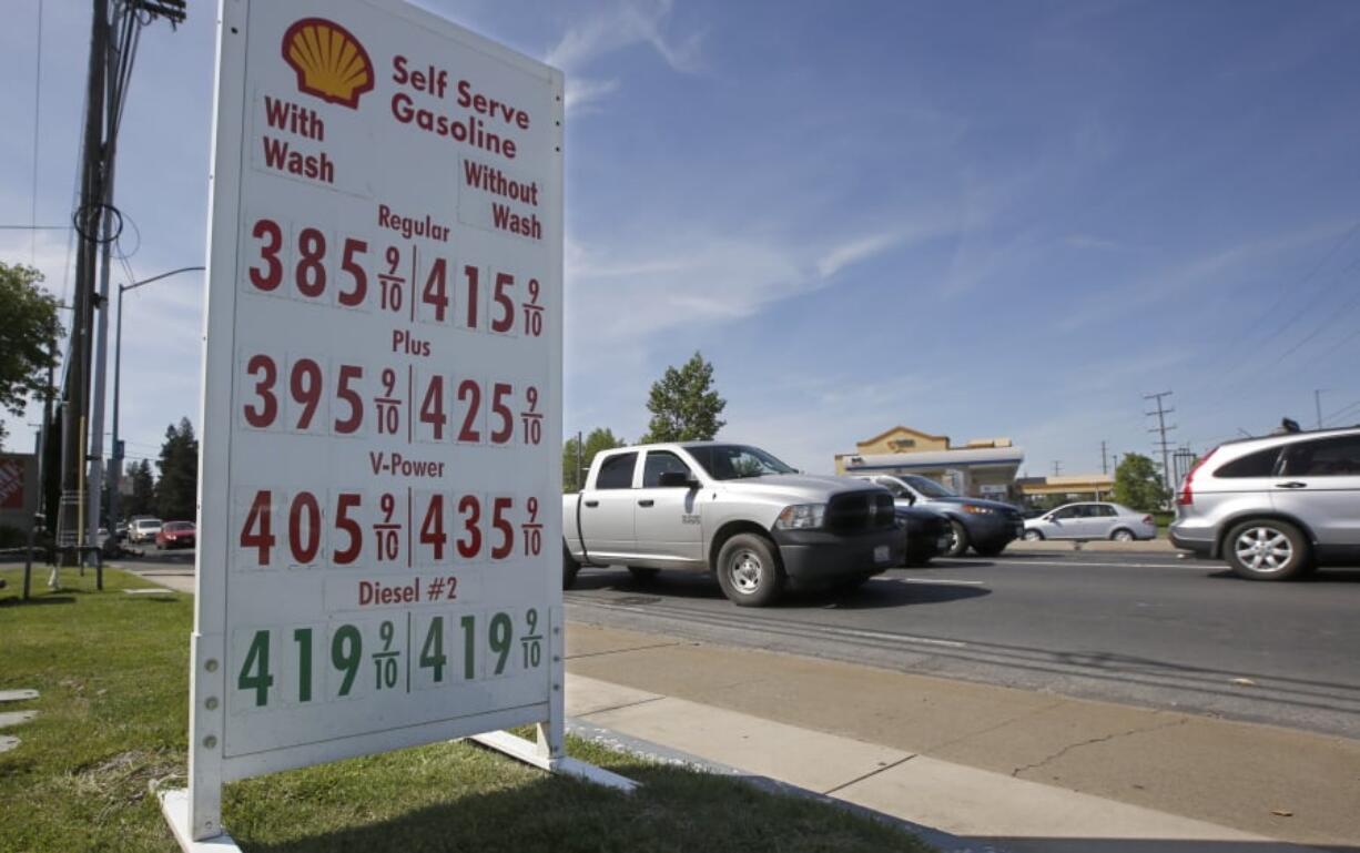 FILE - In this April 23, 2019, file photo gas prices are displayed at a Shell station in Sacramento, Calif. Gasoline for that summer road trip will cost a bit more than experts in the federal government were expecting just a month ago. The government is also predicting higher crude prices, as higher U.S. production is offset by declines elsewhere.