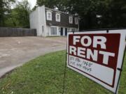 FILE - In this April 23, 2018, file photo a for rent sign denotes the availability of another existing home in Jackson, Miss. Buying a home is often seen as a no-brainer if you have the means. But continuing to rent can give you more flexibility, amenities and time. It can also give you a sense of financial security, since there’s no down payment, repairs or closing costs to eat through your nest egg. (AP Photo/Rogelio V.