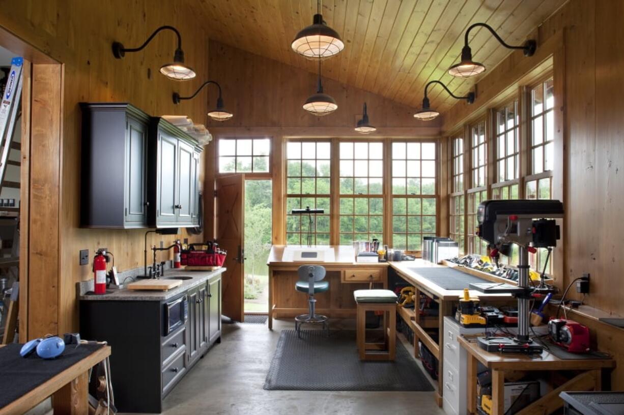 The inside of a garage in Emmitsburg, Md. Detached garages with a second floor, as seen in this project designed by the Bethesda, Md.-based firm Rill Architects, can serve as a space to store cars while also pulling double-duty as guest suites, rooms for crafting or even a playroom for children. If a garage is large enough, it can house a full workshop, shown here, or a home gym, something that’s become increasingly popular with homeowners.