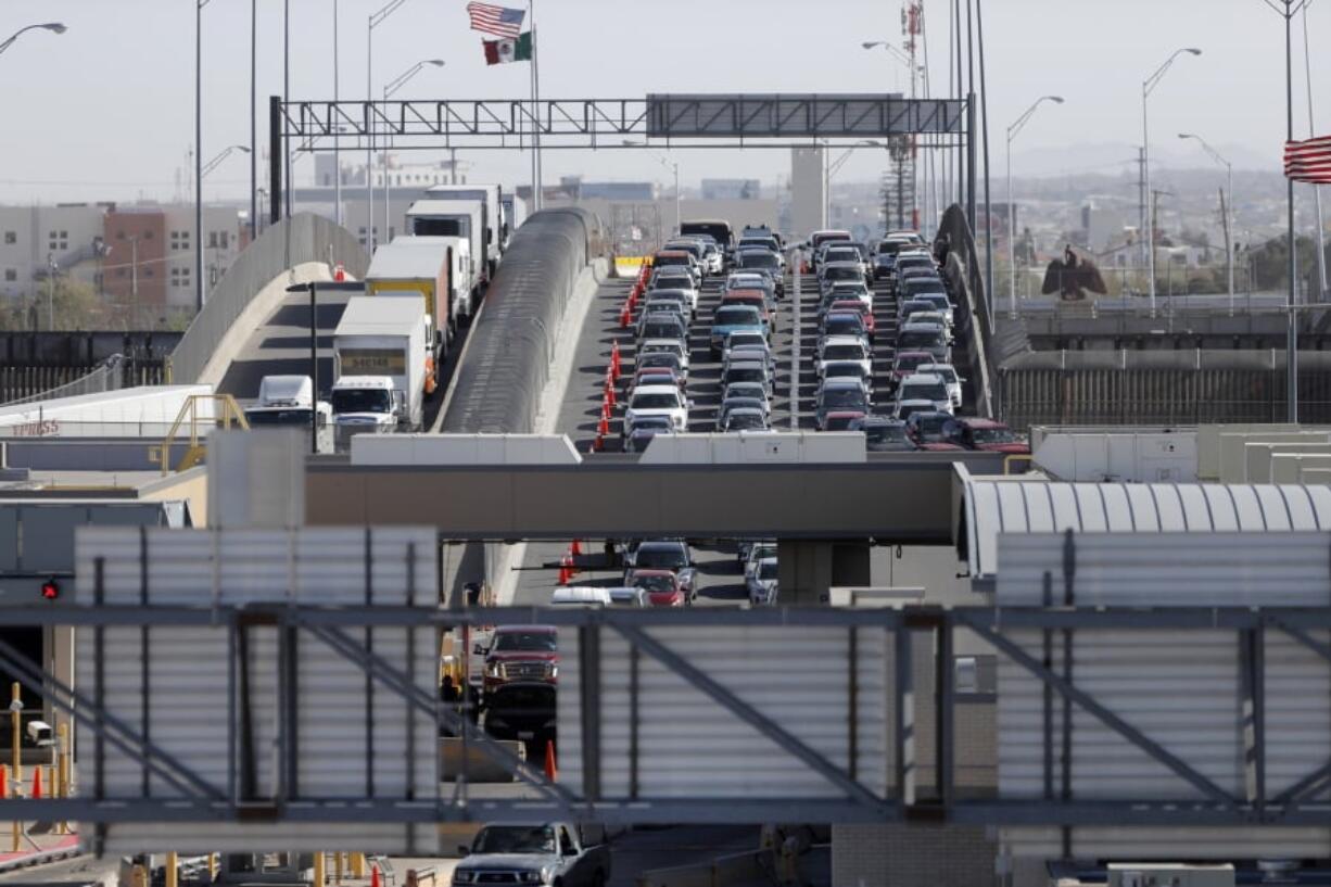 In this March 29, 2019 file photo, cars and trucks line up to enter the U.S. from Mexico at a border crossing in El Paso, Texas. A 2-½-year-old Guatemalan child has died after crossing the border, becoming the fourth minor known to have died after being detained by the Border Patrol since December.