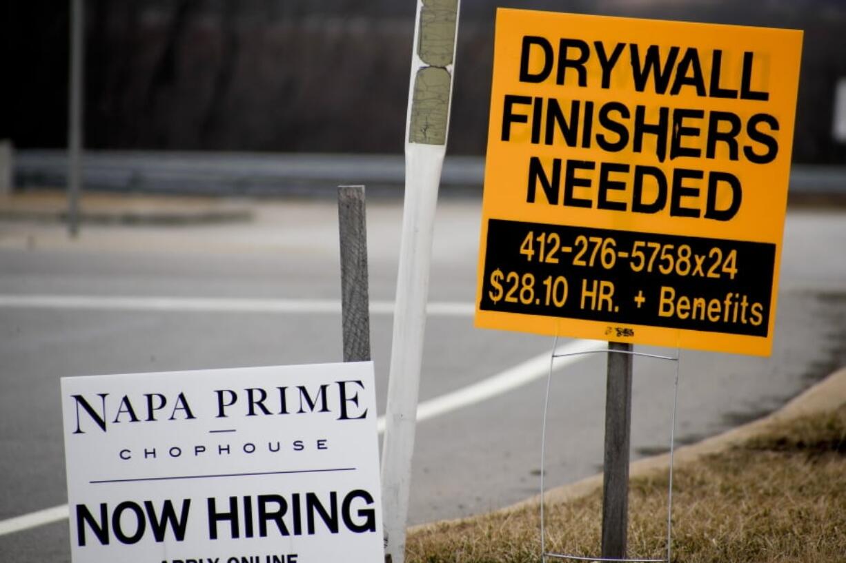 In this March 1, 2019, photo signs for employment opportunities are posted at an exit ramp off of Interstate 79 in Zelienople, Pa. On Tuesday, May 7, the Labor Department reports on job openings and labor turnover for March.